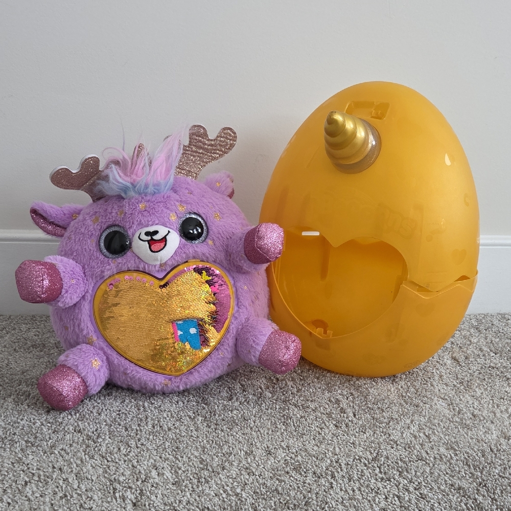 Purple and Gold Stuffed Animal with Egg